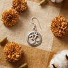 Handcrafted silver Om earring on handloom cloth with marigold | Ramsons Handicrafts